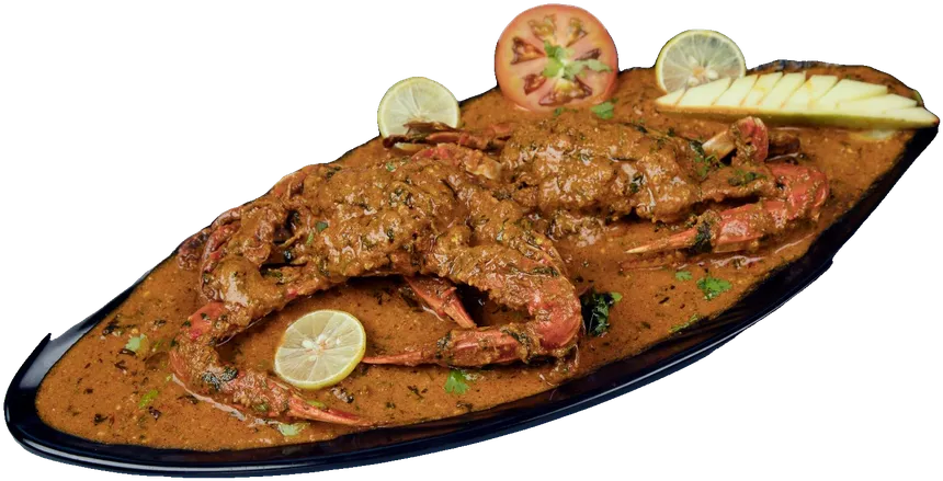 Crab curry with lime on a black platter